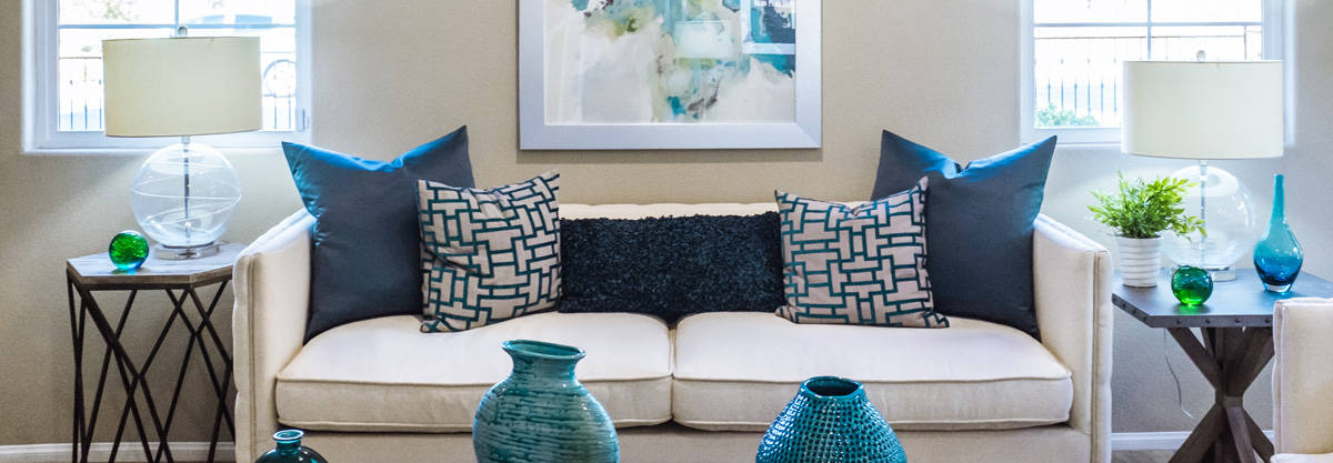 couch with lamps and blue accents